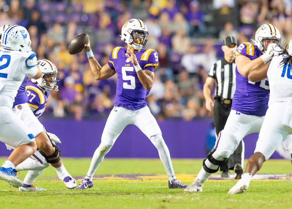 Quarterback Jayden Daniels 5 throws a pass as the LSU Tigers take on Georgia State in Tiger Stadium in Baton Rouge, Louisiana, November 18, 2023. 